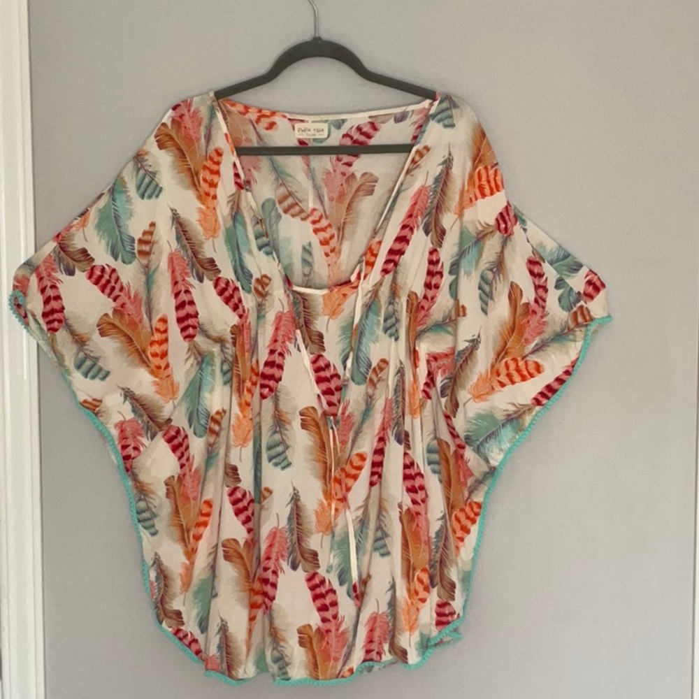 Cotton beach coverup with feather motif.